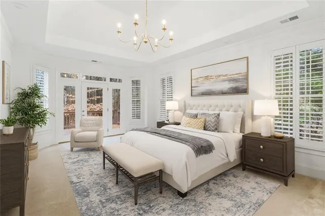 a spacious bedroom with a bed and a large window