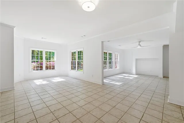 a view of an empty room with windows