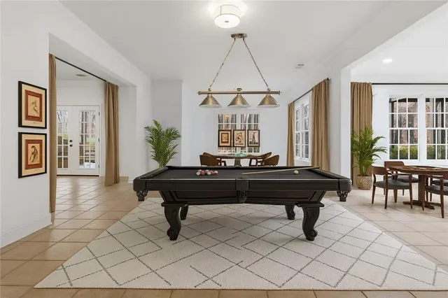 a living room with furniture a piano and a window