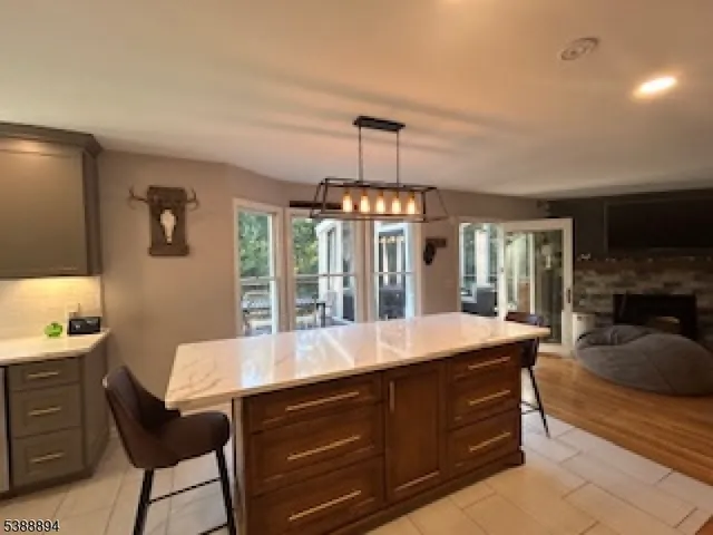 a room with a chandelier furniture and a chandelier