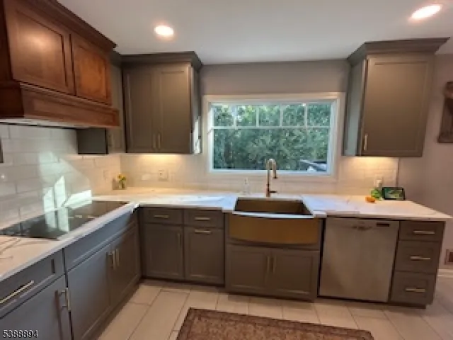 a kitchen with a sink and large window