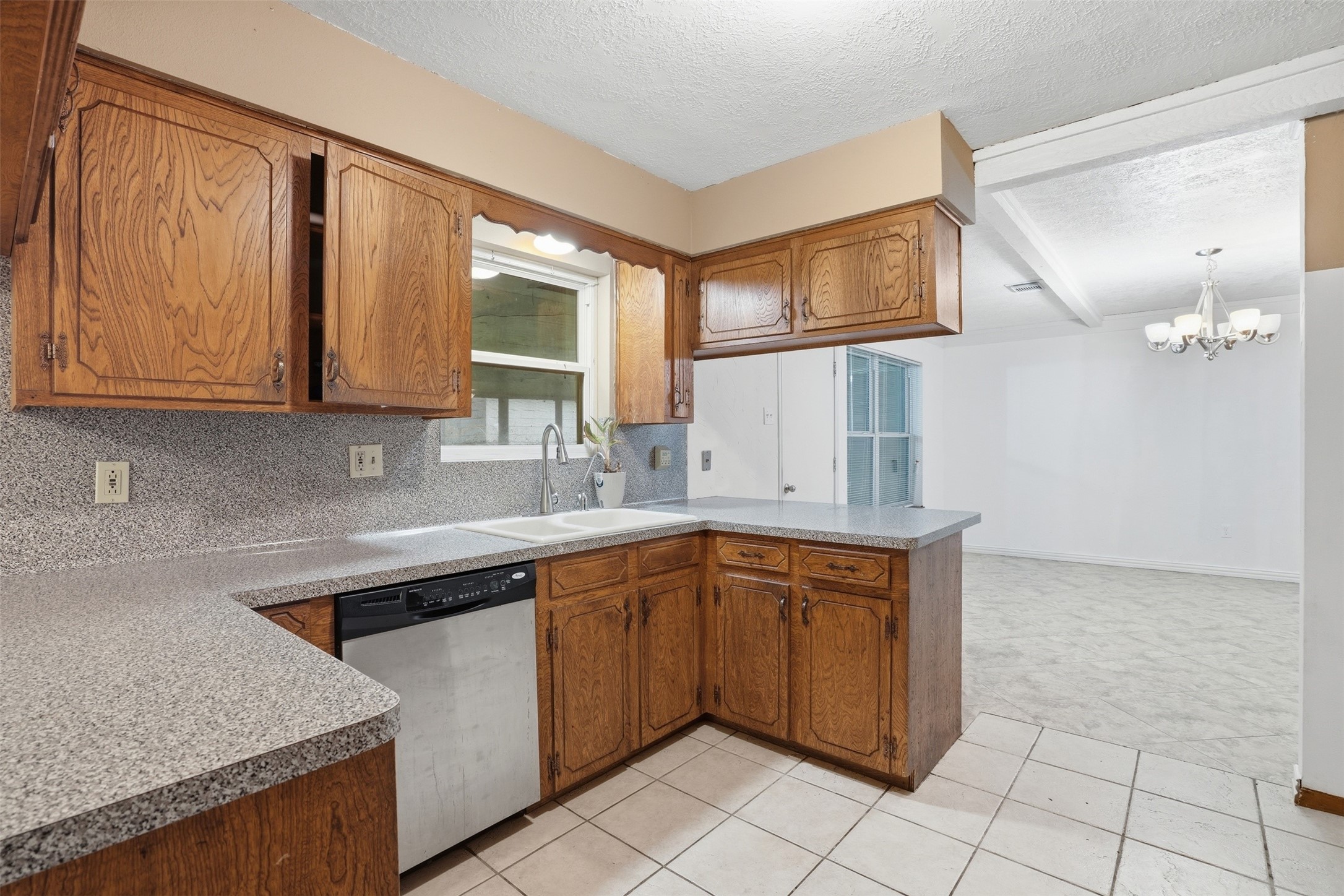 2605 Burke Road Pasadena, TX 77502 - Photo 6 of 29 a kitchen with a sink cabinets and window