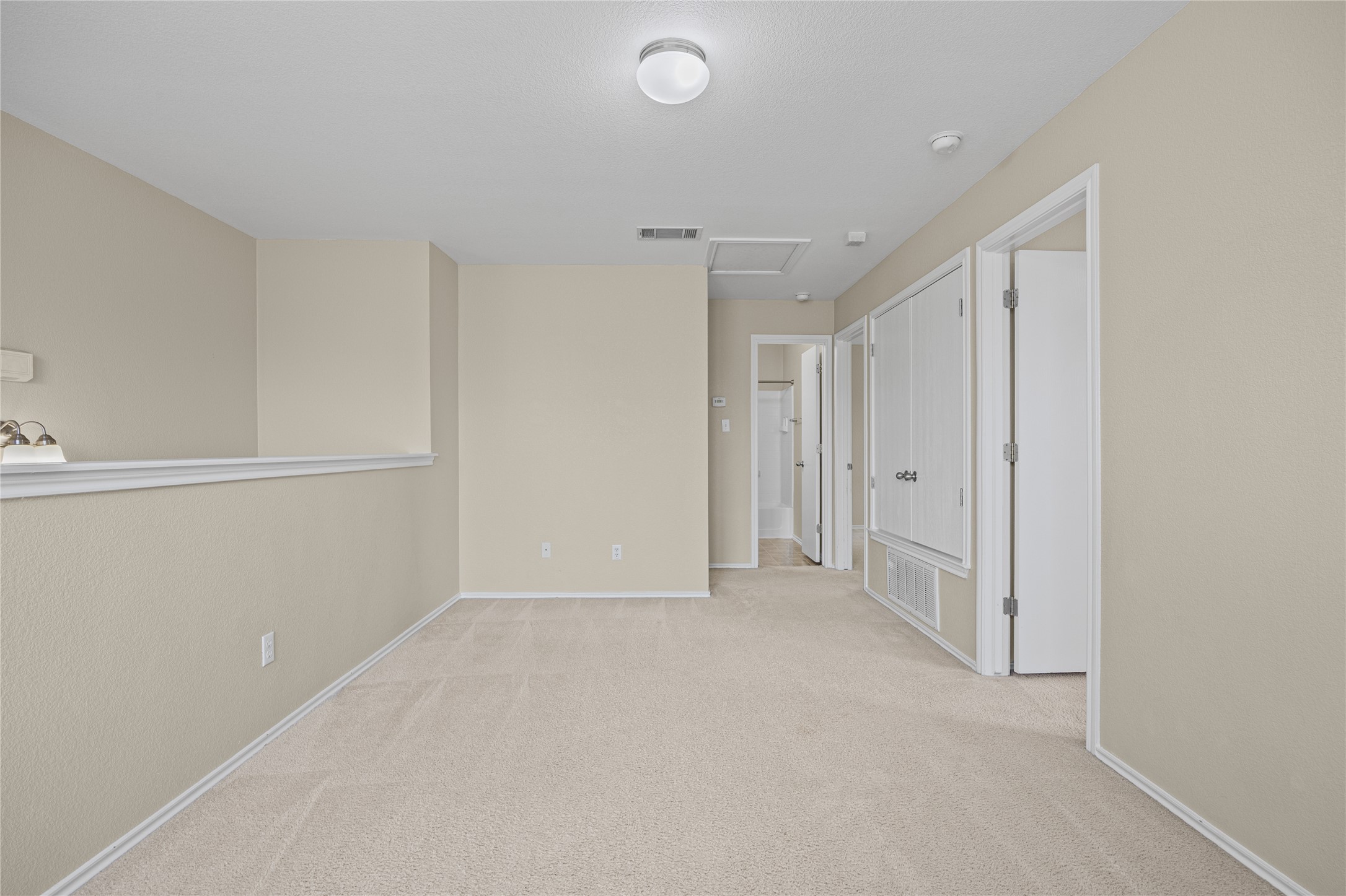 198 Black Forest Road Buda, TX 78610 - Photo 10 of 23 A spacious, naturally illuminated loft provides versatile living options.