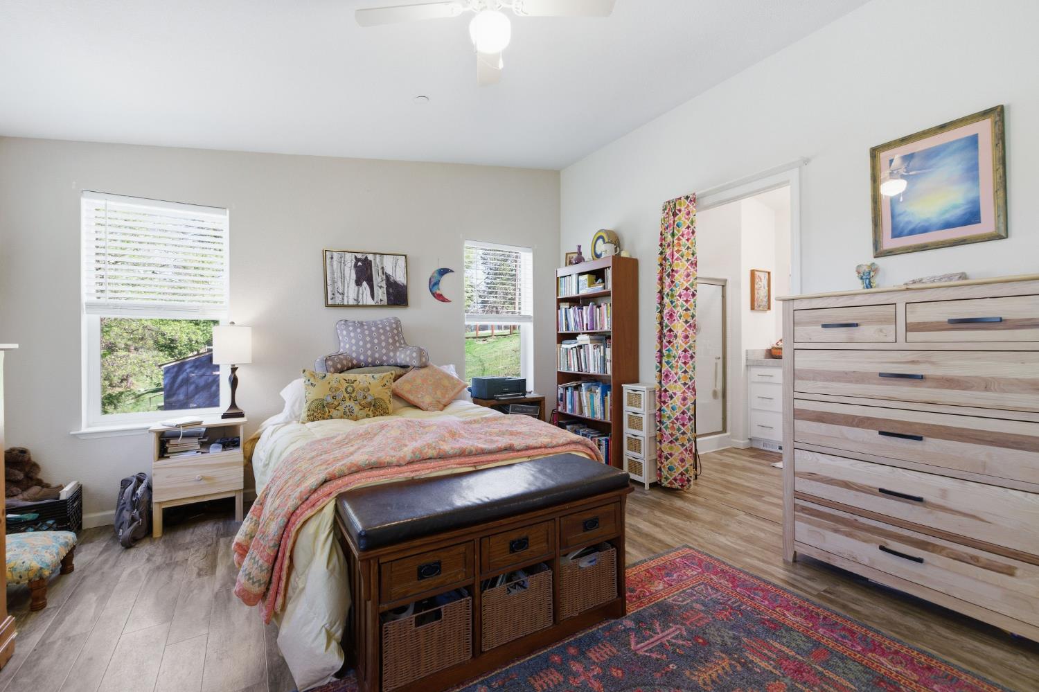 5015 Shooting Star Road Pollock Pines, CA 95726 - Photo 13 of 44 a bedroom with a bed and a bookshelf