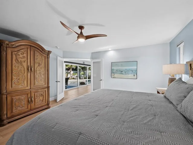 a spacious bedroom with a large bed and a window