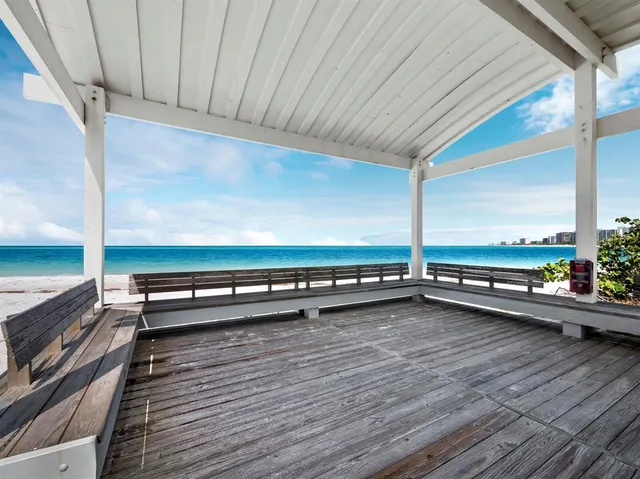 an aerial view of residential building and ocean view