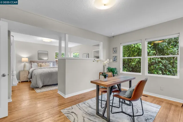 a dining room with furniture and window