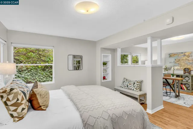 a bedroom with a bed and a window