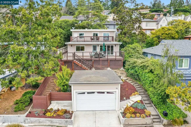 an aerial view of a house with a garden