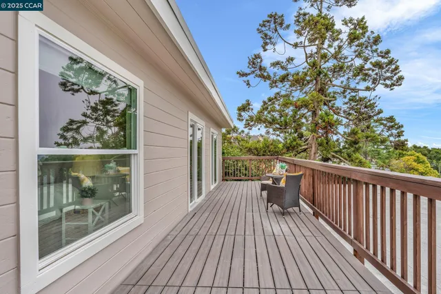 a view of a balcony with wooden floor