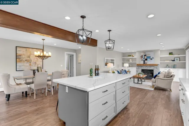 a large kitchen with a table and chairs