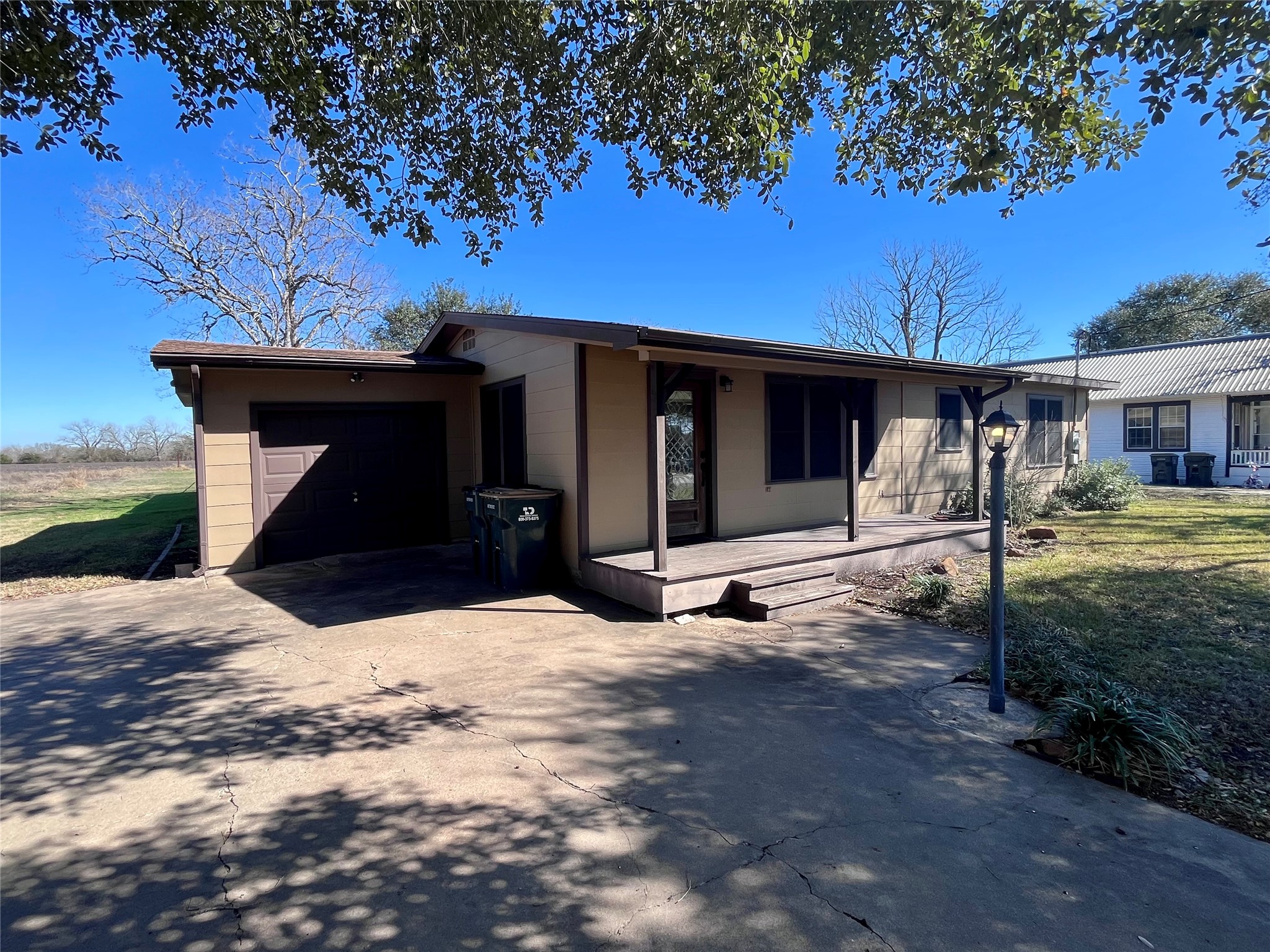 1004 North Center Street Weimar, TX 78962 - Photo 10 of 15 a view of a house with a yard