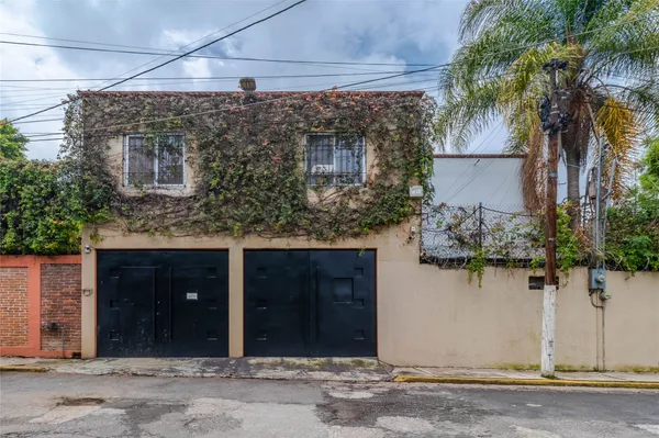 a view of a house with a tree