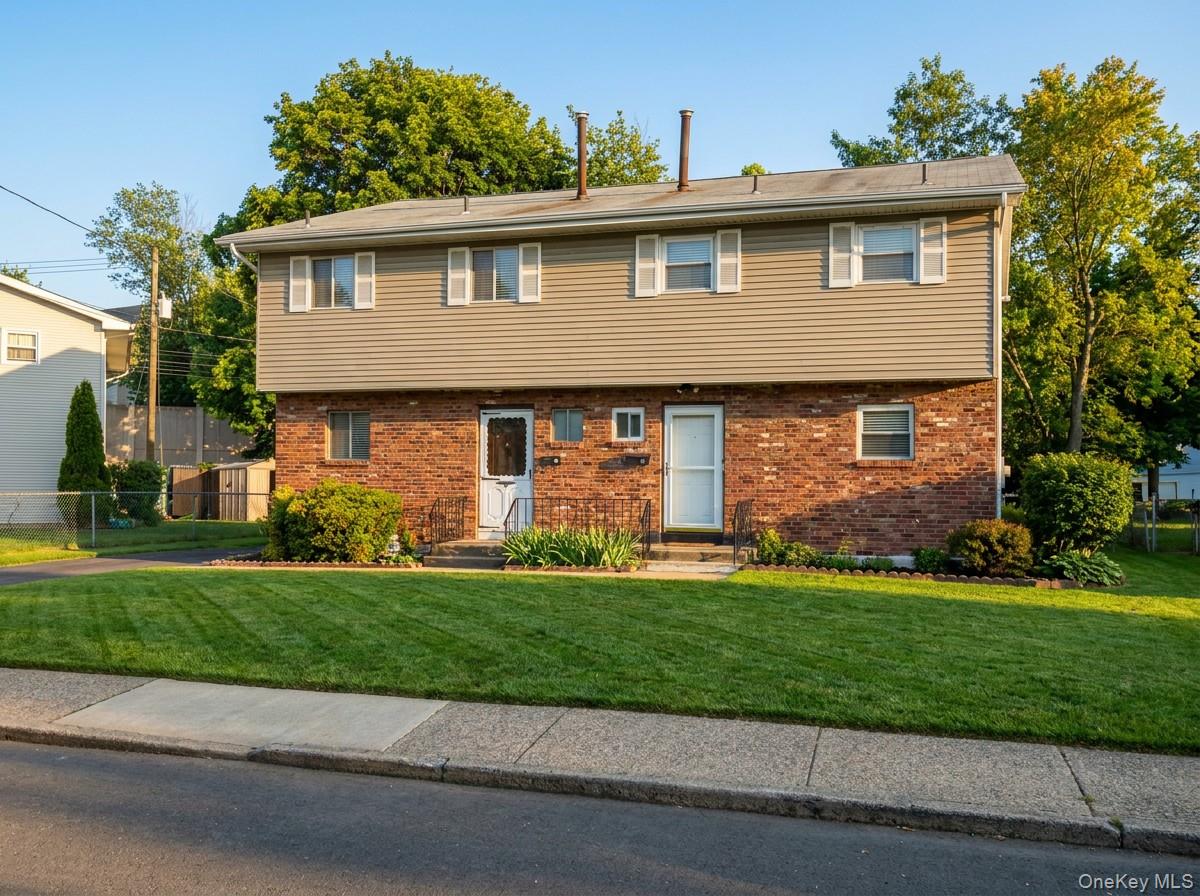 2 Sneden Court Spring Valley, NY 10977 - Photo 1 of 13 a front view of a house with a yard
