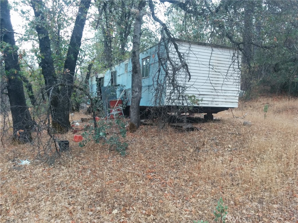 0 Donkey Mine Road Oak Run, CA 96069 - Photo 2 of 8 a backyard of a house with table and chairs