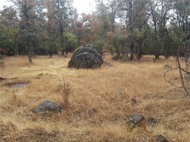 a sign board on a brick wall