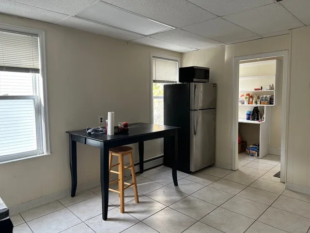 a kitchen with stainless steel appliances granite countertop cabinets and a stove top oven