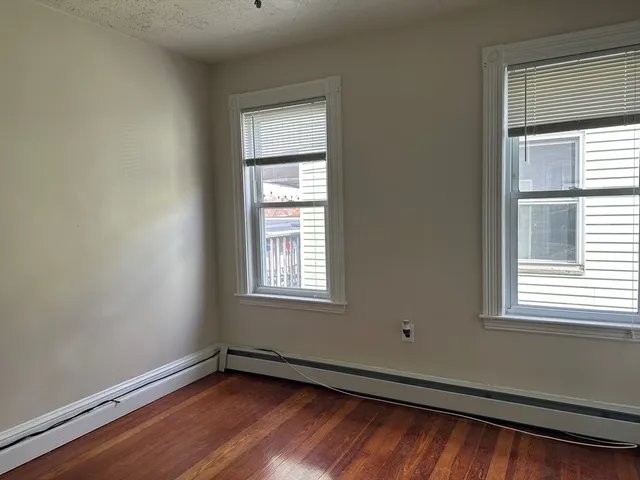 a kitchen with a refrigerator a microwave and a sink