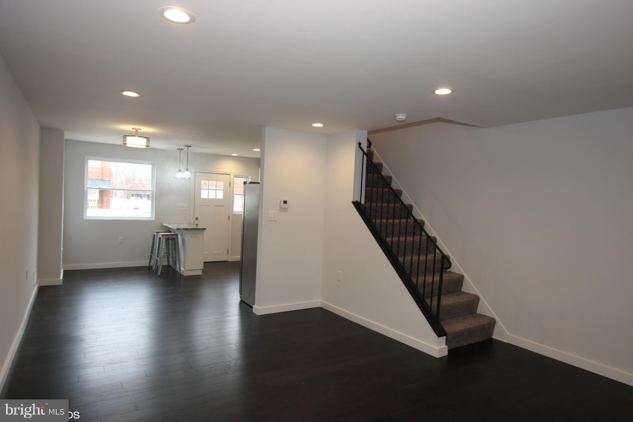 1920 Jasmine Road Baltimore, MD 21222 - Photo 11 of 40 Engineered Wood Plank Floors Custom Iron Railing.