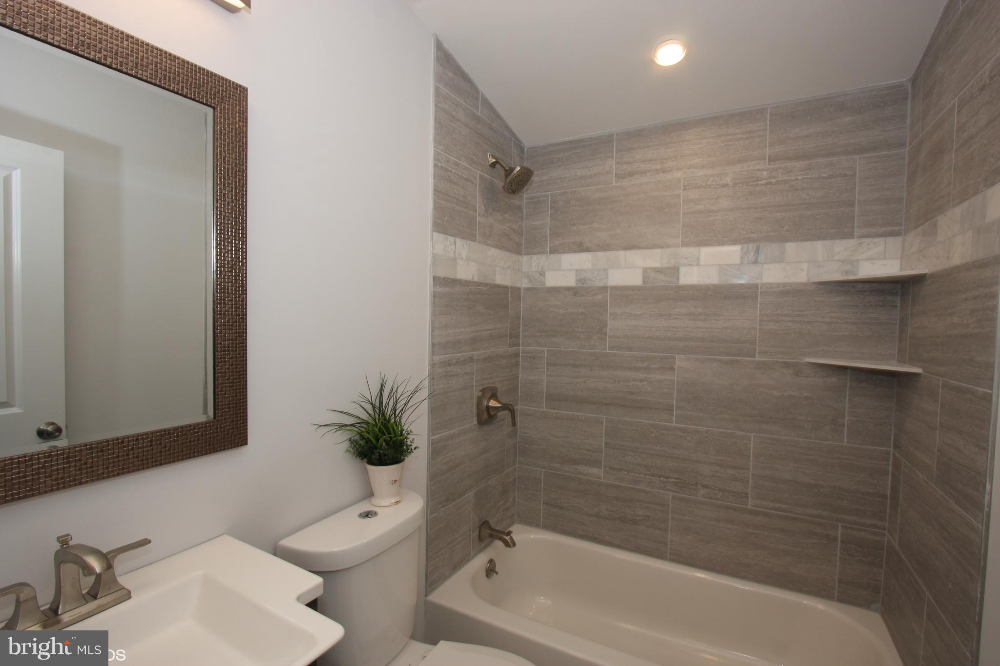 1920 Jasmine Road Baltimore, MD 21222 - Photo 17 of 40 Note Custom Tiled to Ceiling