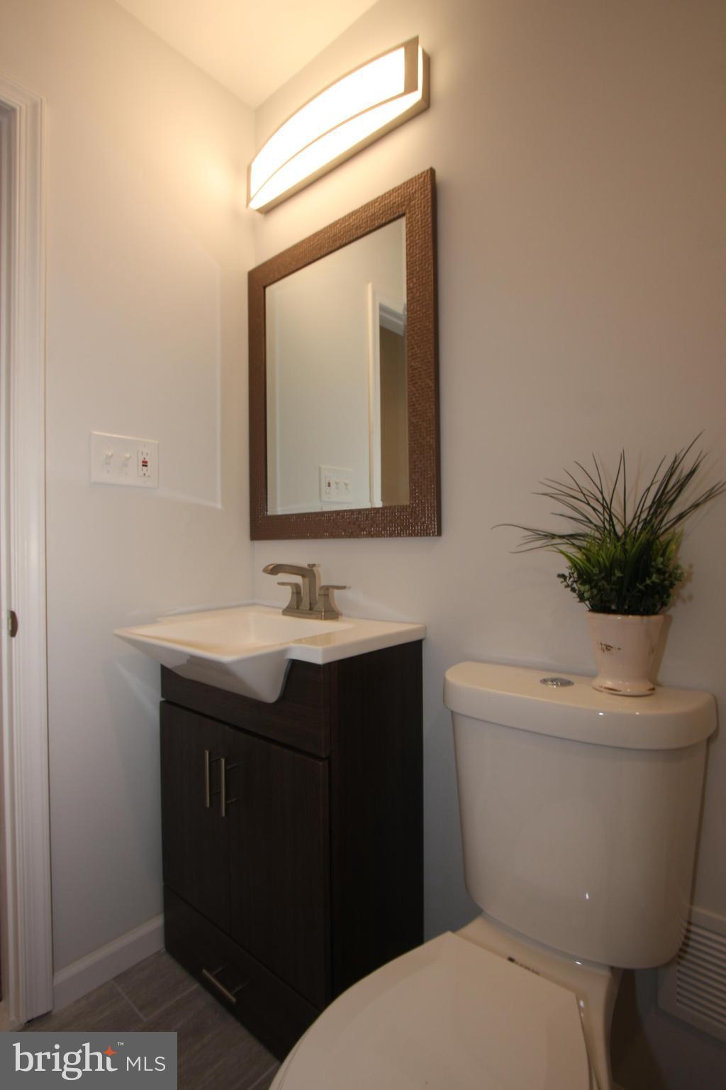 1920 Jasmine Road Baltimore, MD 21222 - Photo 19 of 40 Euro Vanity with LED Lighting; New Toilet