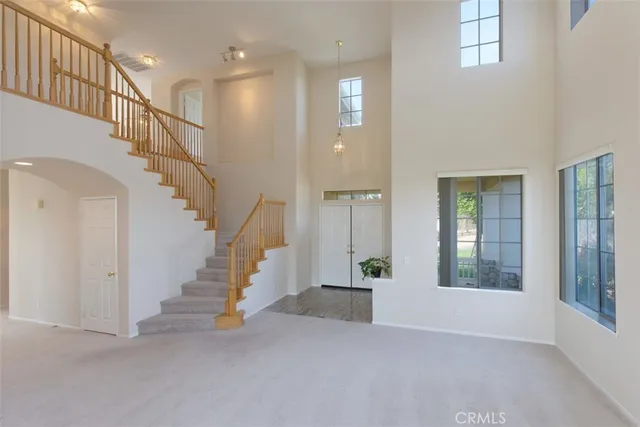 a view of entryway and hall with a window