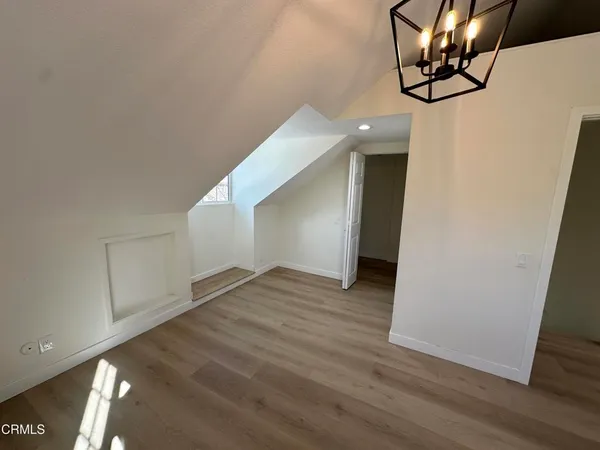 a view of a livingroom with wooden floor
