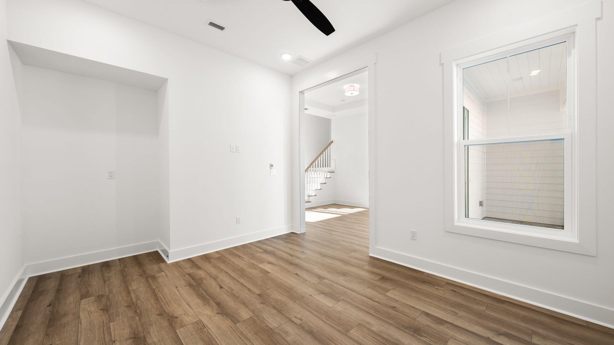 33 Dunns Cir Inlet Beach Inlet Beach, FL 32461 - Photo 30 of 82 an empty room with wooden floor and windows