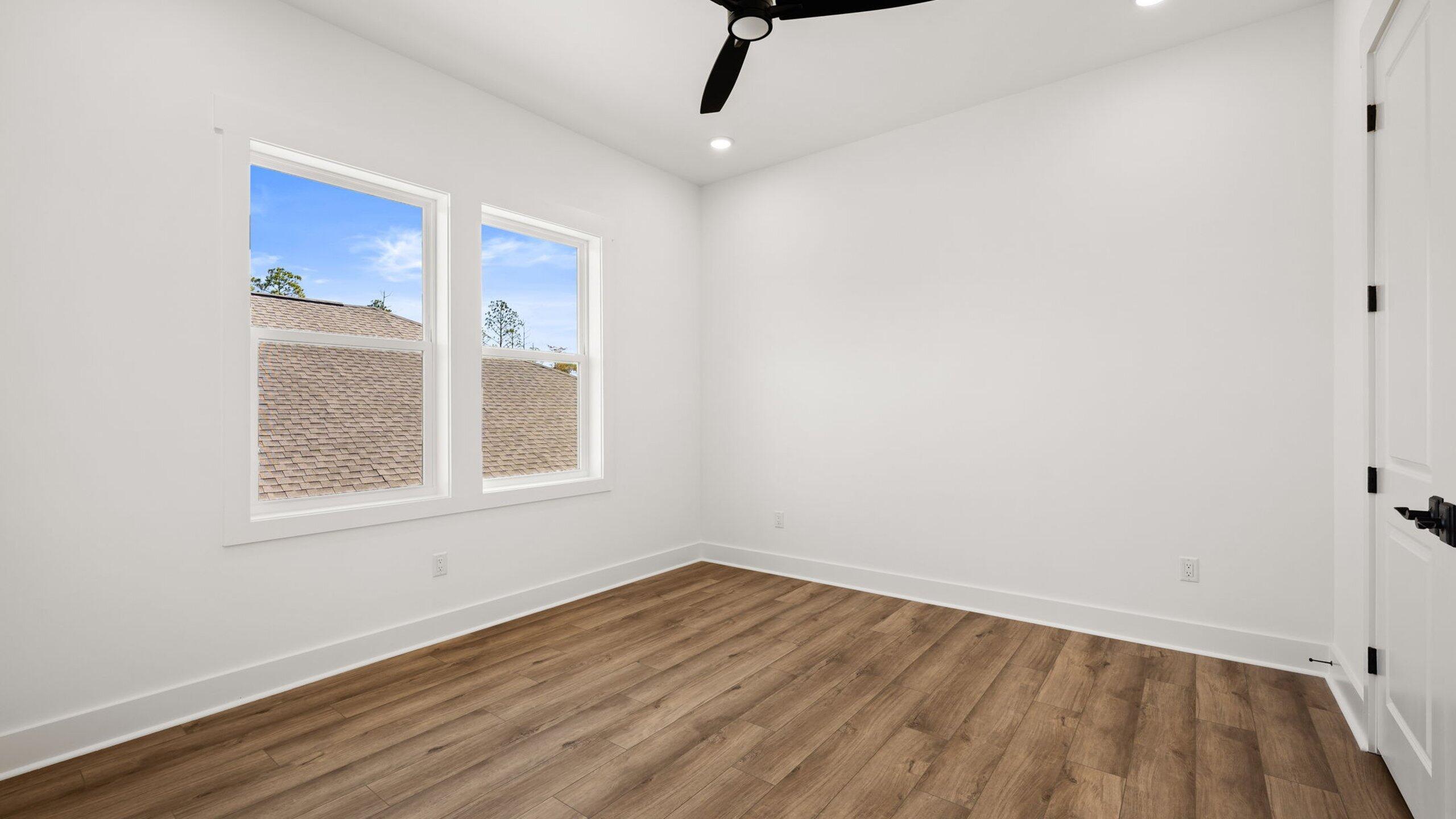 33 Dunns Cir Inlet Beach Inlet Beach, FL 32461 - Photo 40 of 82 a view of an empty room with wooden floor and a window