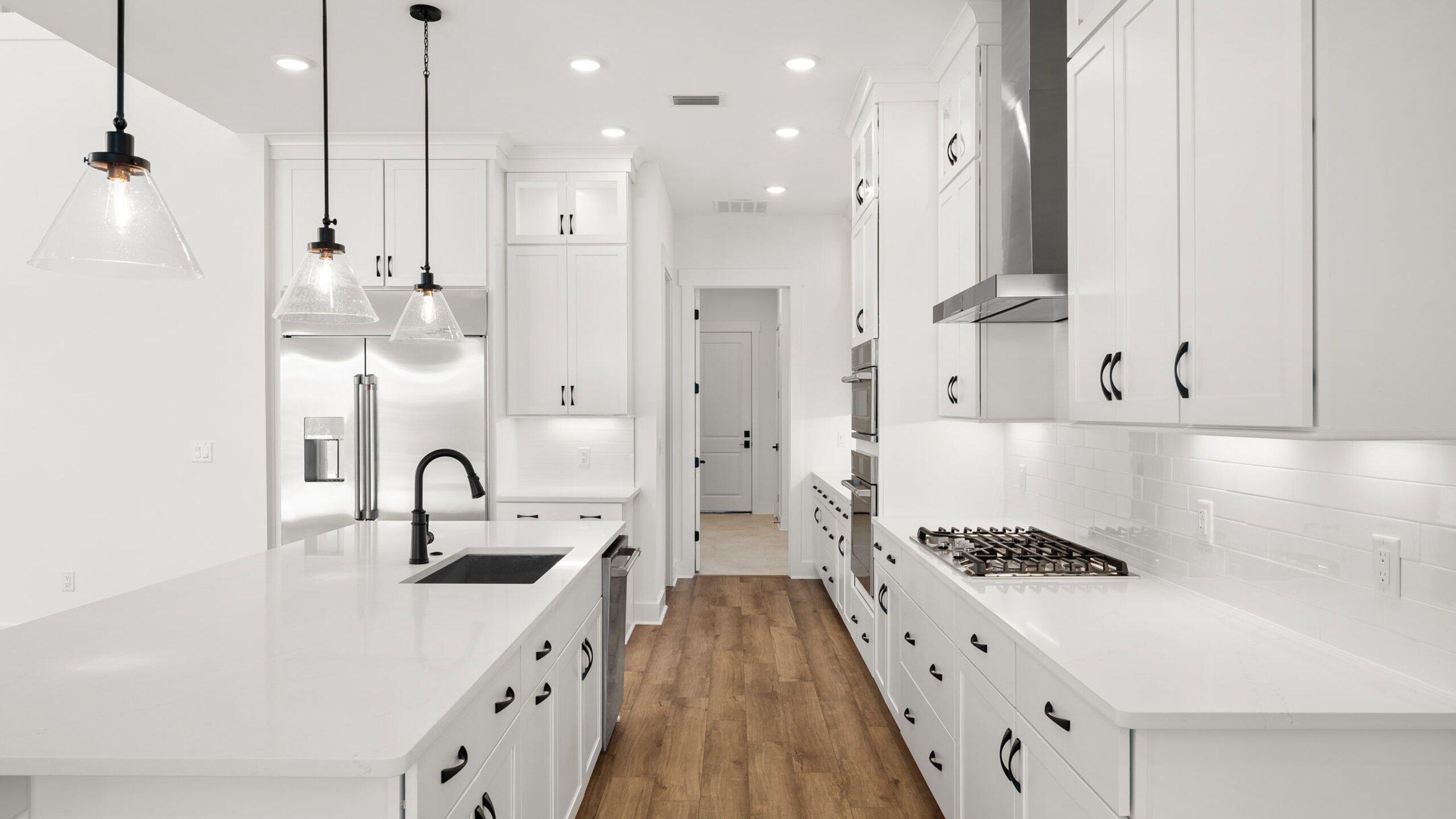 33 Dunns Cir Inlet Beach Inlet Beach, FL 32461 - Photo 4 of 82 a large kitchen with stainless steel appliances a large counter top a stove a sink dishwasher and a refrigerator with wooden floor