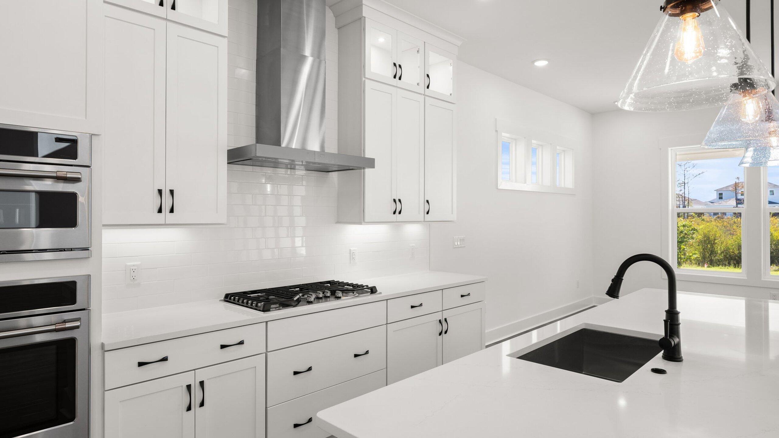 33 Dunns Cir Inlet Beach Inlet Beach, FL 32461 - Photo 7 of 82 a kitchen with stainless steel appliances a white stove top oven and white cabinets