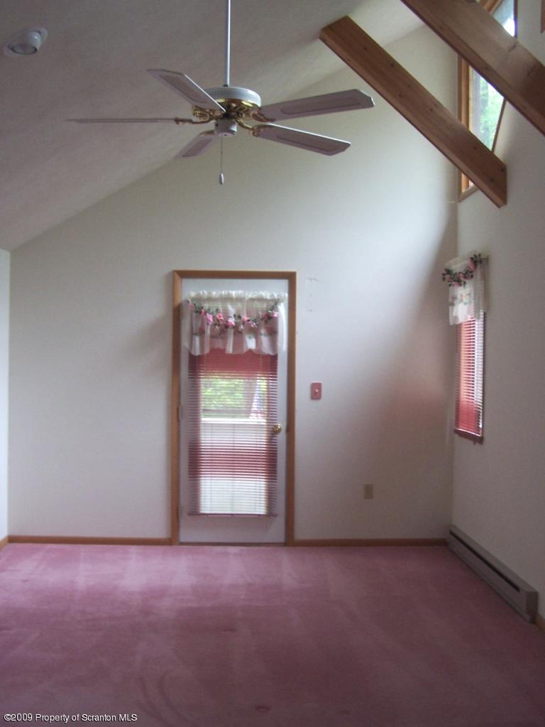 3284 Northgate Road Lake Ariel, PA 18436 - Photo 9 of 14 an empty room with windows and fan