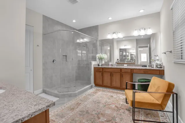 a view of a lake with a big yard and potted plants