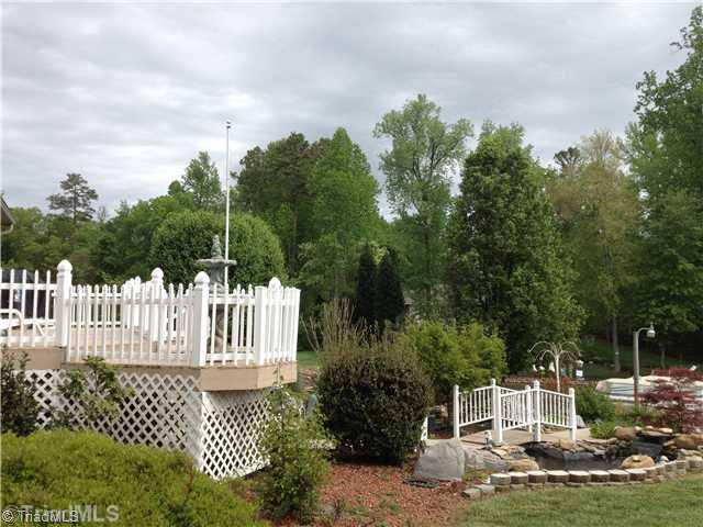 930 Mainsail Road Salisbury, NC 28146 - Photo 3 of 14 Exterior Back. Amazing landscaping and grand entry to boat dock.