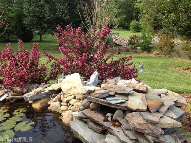 930 Mainsail Road Salisbury, NC 28146 - Photo 7 of 14 Landscaping. Koi pond with lush lilypads.