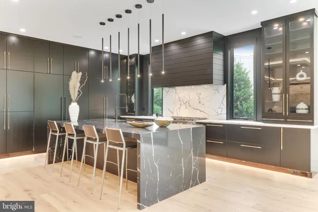 a spacious bedroom with a large bed and a large window