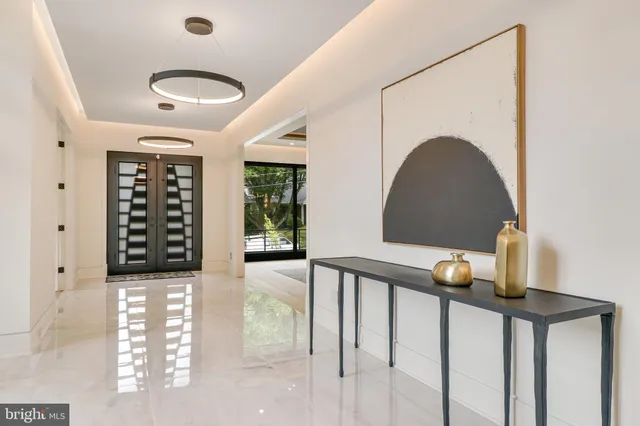 a kitchen with stainless steel appliances kitchen island furniture and large windows