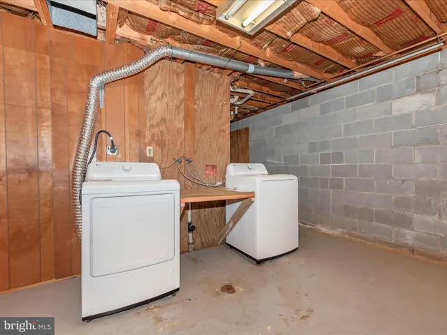 a view of a house with swimming pool and a yard