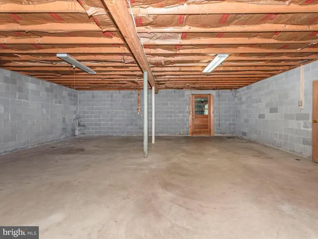 a view of a patio with a table and chairs