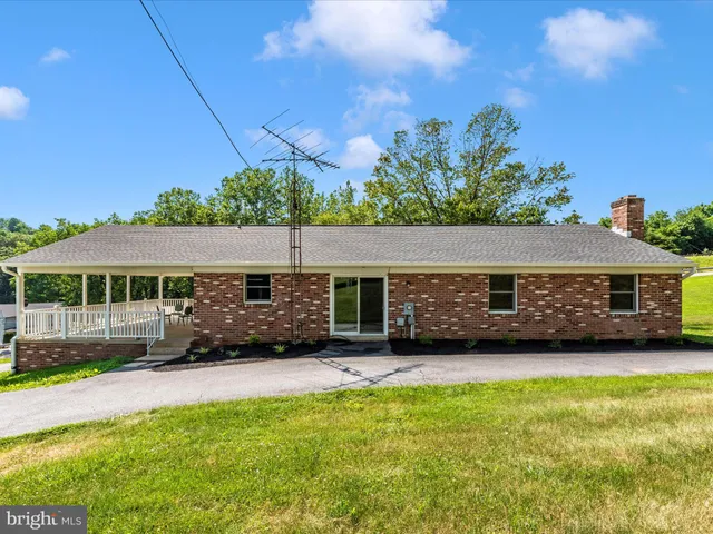 a view of a patio with a big yard
