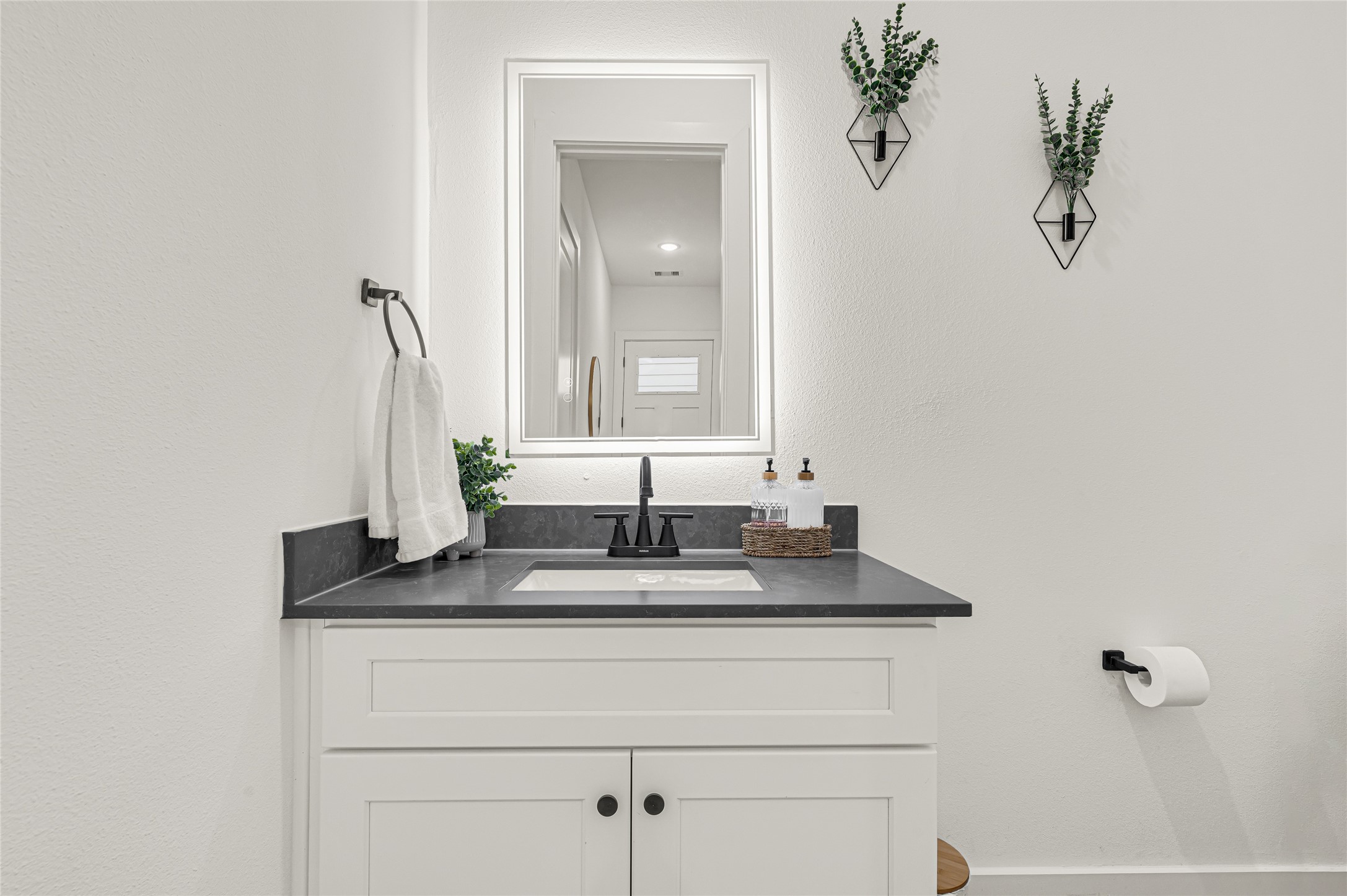4201 Stassen Street Houston, TX 77051 - Photo 6 of 39 a bathroom with a sink and a mirror