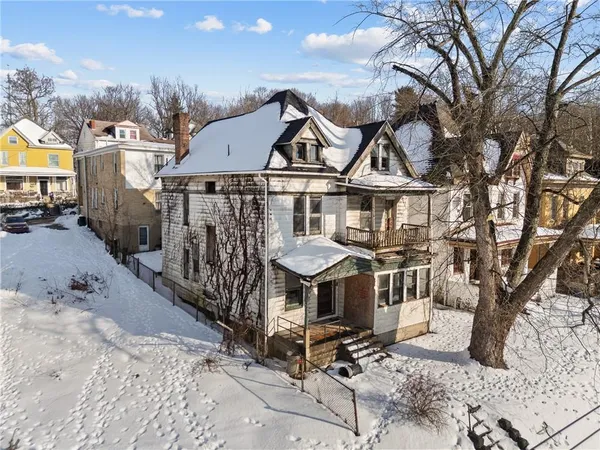 a view of a chairs and table in the patio