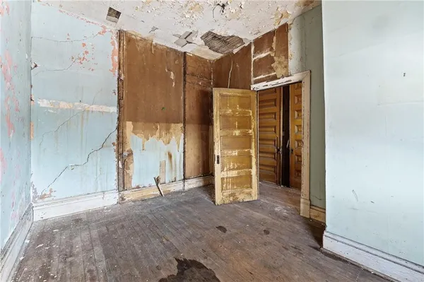 a view of entryway with wooden floor and stairs