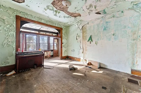 a living room with fireplace furniture and a window