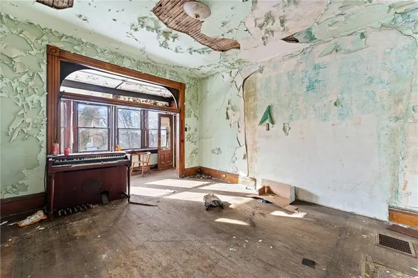 a living room with fireplace furniture and a window