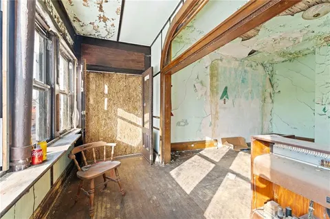 a bathroom with a tub a sink and glass door