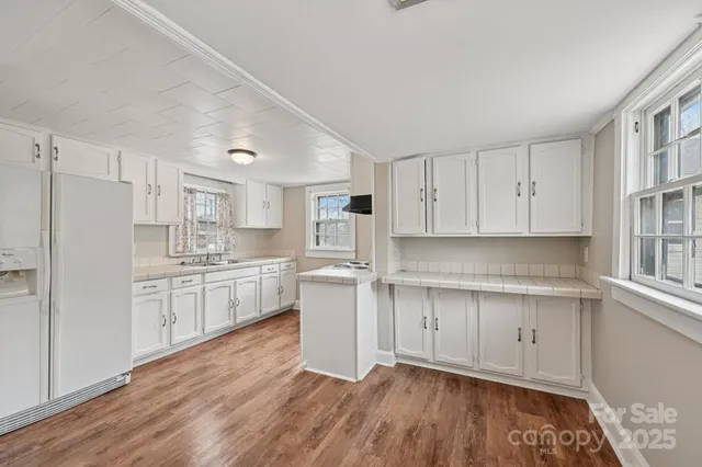 a kitchen with stainless steel appliances granite countertop a stove and a sink