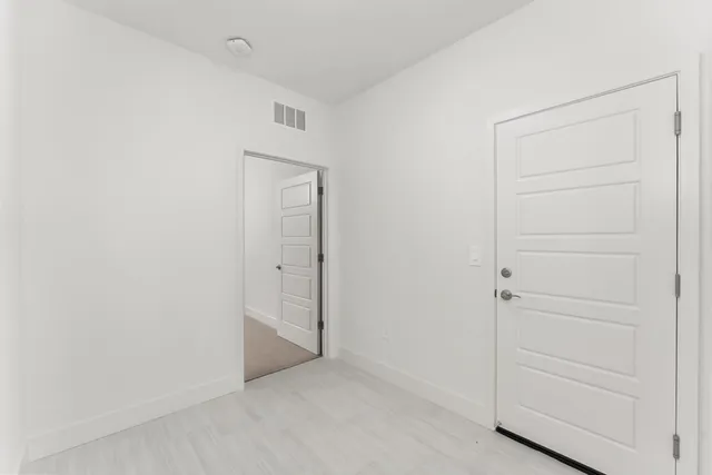 an empty room with closet area