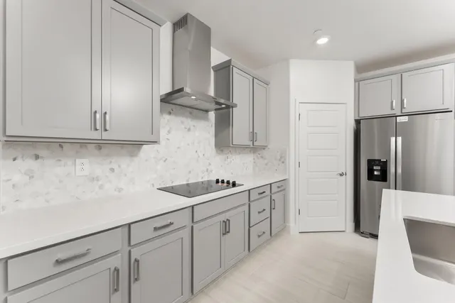 a kitchen with stainless steel appliances white cabinets and a sink