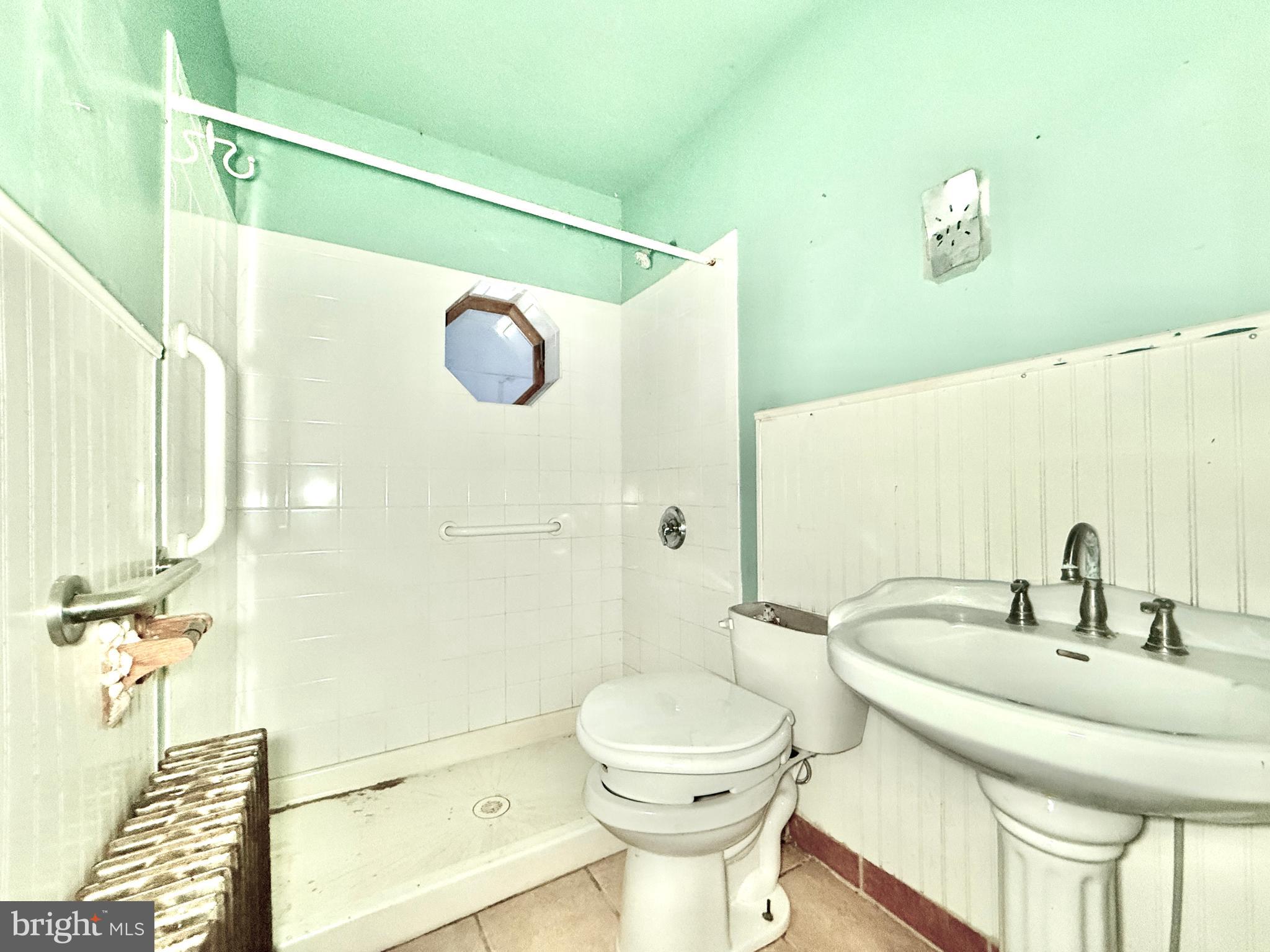 830 North Tuckahoe Road Williamstown, NJ 08094 - Photo 22 of 28 a bathroom with a sink a toilet and shower